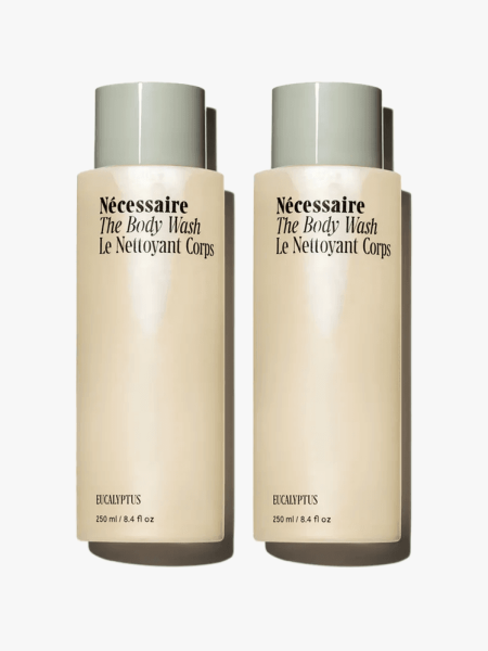 Nécessaire The Body Wash Duo Set in branded components on a light gray background